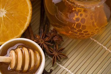 Image showing fresh honey with honeycomb, spices and fruits