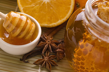 Image showing fresh honey with honeycomb, spices and fruits