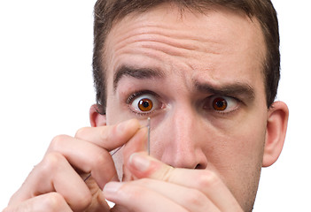 Image showing Man Threading A Needle