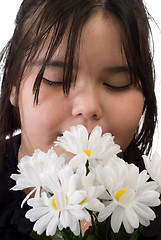 Image showing Girl Smelling Flowers