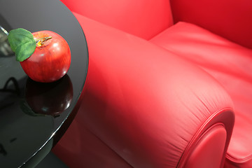 Image showing red apple and a red easy chair