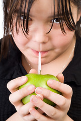 Image showing Girl Drinking Apple Juice