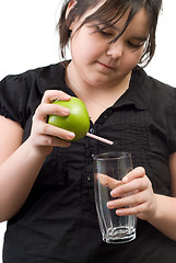 Image showing Girl Pouring Juice