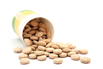 Image showing homeopathic pills isolated on a white