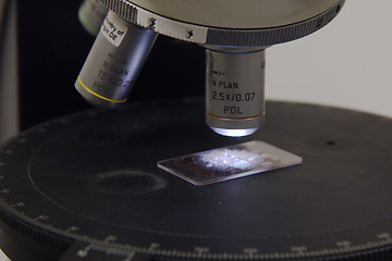 Image showing petrographic sample being analyzed