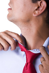 Image showing adjusting the necktie