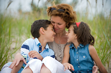 Image showing happy mother and kids on the beach