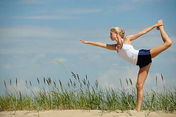 Image showing Beautiful female workout on the beach