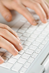 Image showing male hands typing