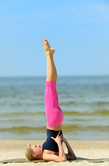 Image showing Beautiful female workout on the beach