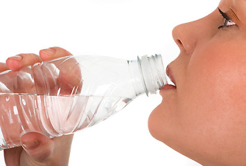 Image showing Girl drinking mineral water