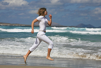 Image showing Running woman on the beach