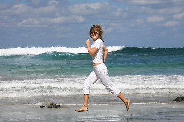 Image showing Running woman on the beach