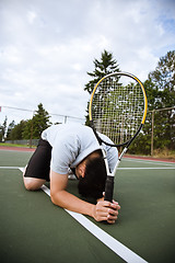 Image showing Sad tennis player after defeat