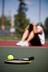 Image showing Sad tennis player after defeat