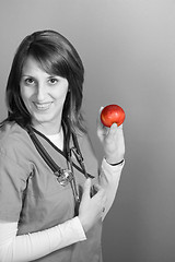 Image showing Nurse With An Apple