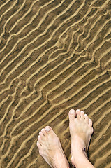 Image showing Feet in shallow water