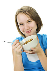 Image showing Girl eating cereal