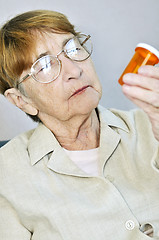 Image showing Elderly woman with pill bottle