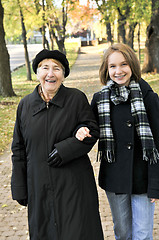 Image showing Granddaughter walking with grandmother