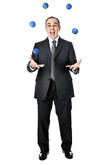 Image showing Businessman juggling