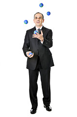 Image showing Businessman juggling