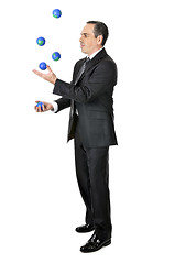 Image showing Businessman juggling