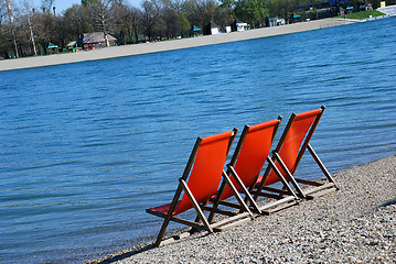 Image showing Orange folding chairs