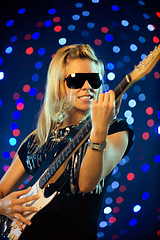 Image showing Female guitar player