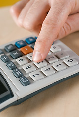 Image showing male hand and calculator