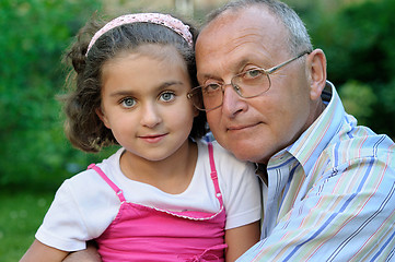 Image showing Grandfather and kid outdoors