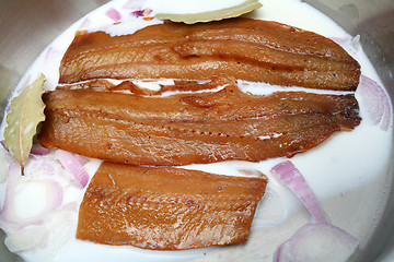 Image showing Kippers with milk and onion