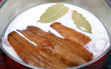 Image showing Kippers with milk and onion