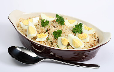 Image showing Kedgeree rice with eggs and parsley horizontal