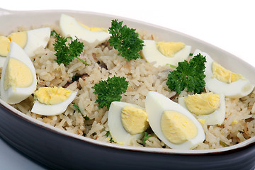 Image showing Kedgeree rice with eggs and parsley horizontal