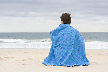 Image showing Woman sitting on the beach