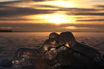 Image showing Sunset over frozen lake