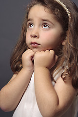 Image showing Innocent girl looking up