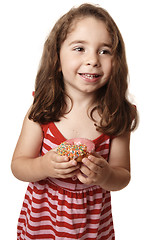 Image showing Smiling girl with doughnut