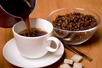 Image showing cup of coffee, sugar and beans