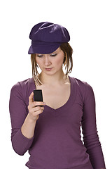 Image showing Checking the mobile phone