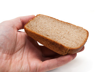 Image showing Piece of the pumpernickel in hand