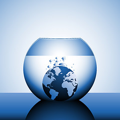 Image showing A globe sinking in water