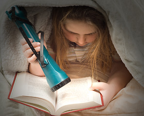 Image showing Reading With Flashlight