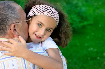 Image showing Grandfather and kid outdoors