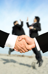 Image showing Success businessmen shaking hands