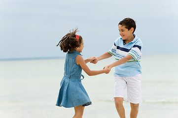 Image showing Happy kids having fun on the beach