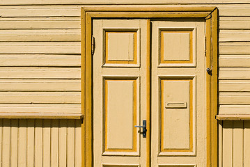 Image showing Yellow wooden door