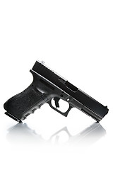 Image showing handgun with natural reflection