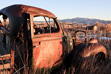 Image showing abandoned car in field